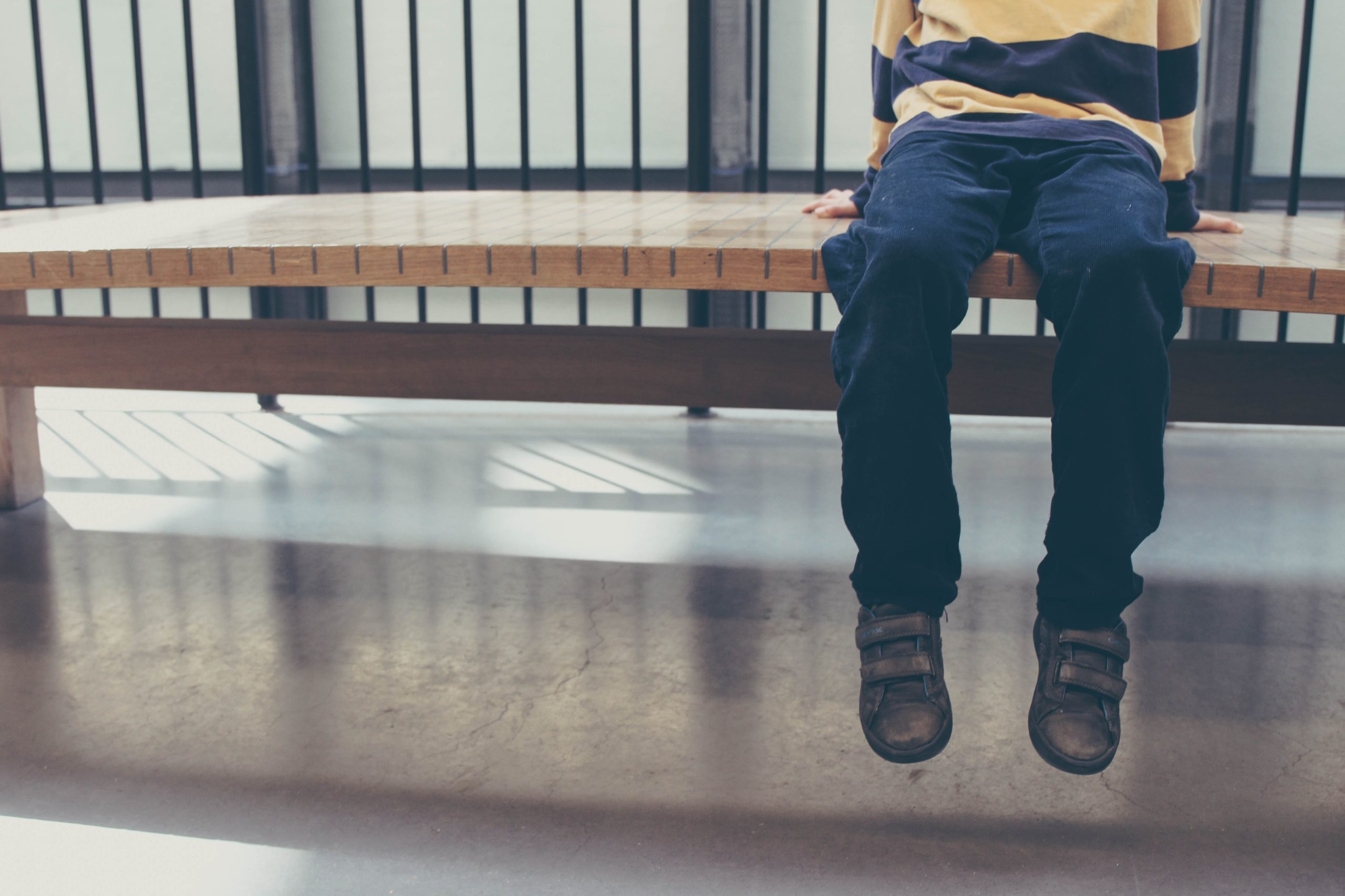 child alone on bench